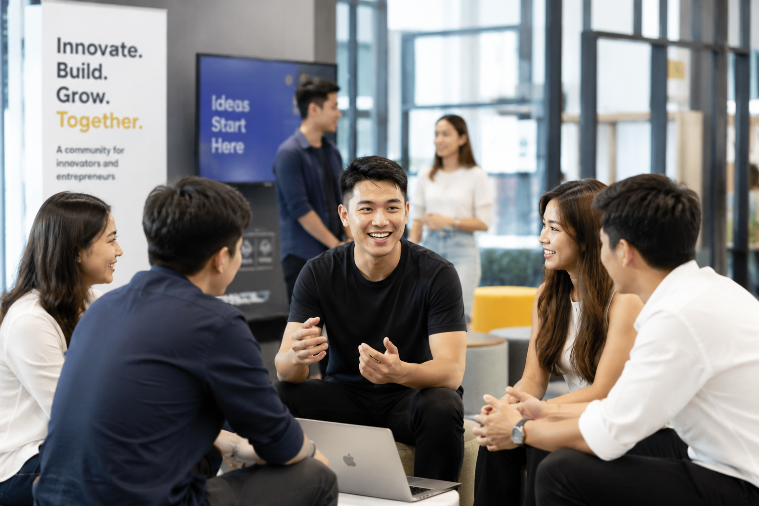 A mentor sitting down and discussing with people